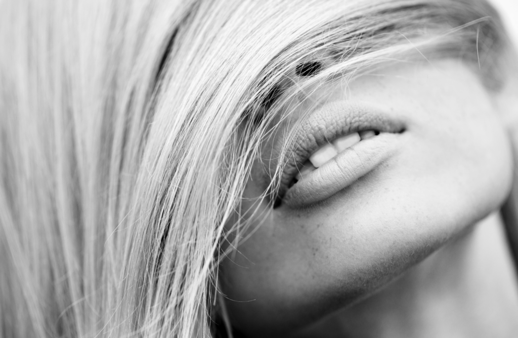 Ombré hair color technique, showing a distinct root to tip gradient from light to dark or light to light